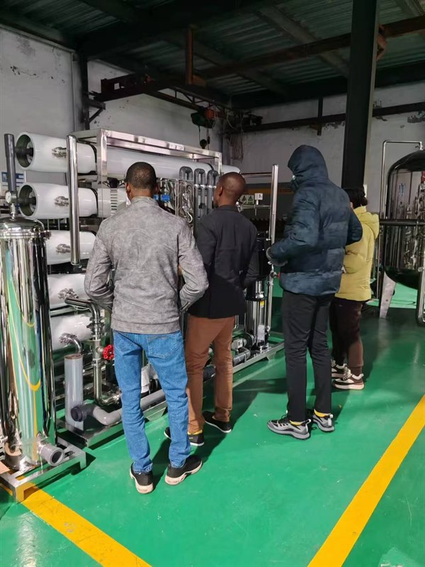 Overseas customers inspecting RO systems in our workshop